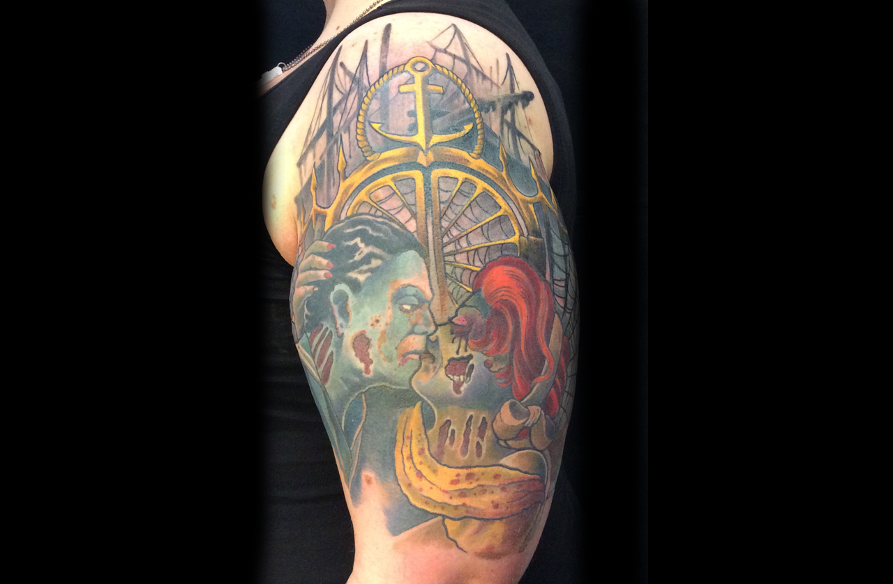 Oberarmtattoo mit Zombies