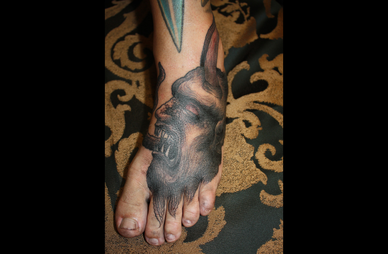 Fusstattoo eines Dämons